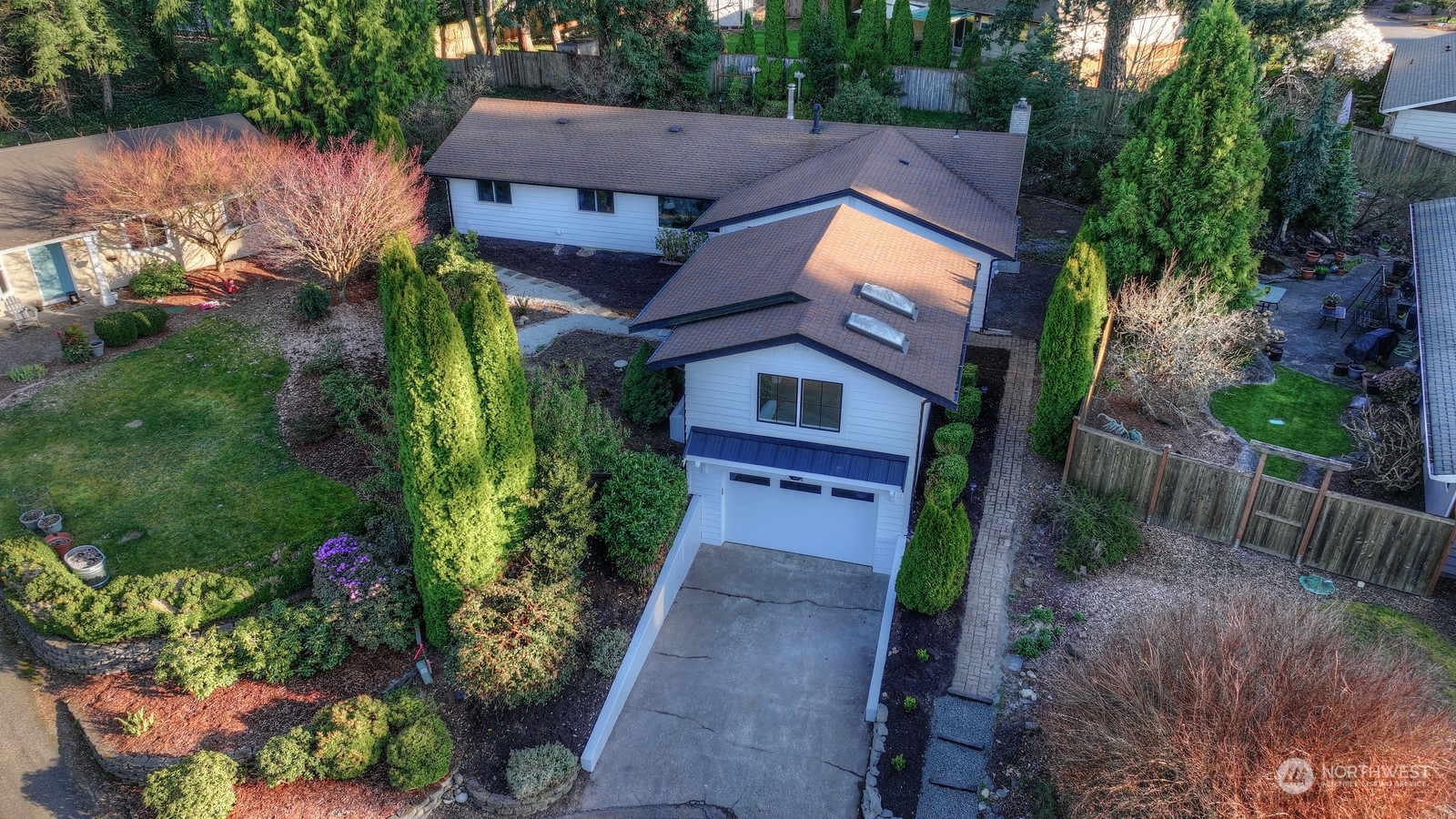 4008 66th Street Gig Harbor, WA 98335 - Photo 2 of 39 a view of a house with a small yard plants and large tree