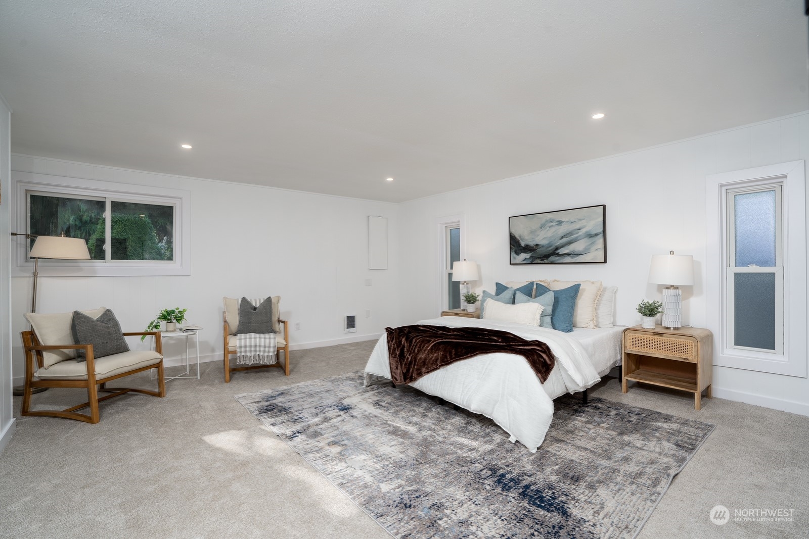 4008 66th Street Gig Harbor, WA 98335 - Photo 23 of 39 a spacious bedroom with a bed and a couch