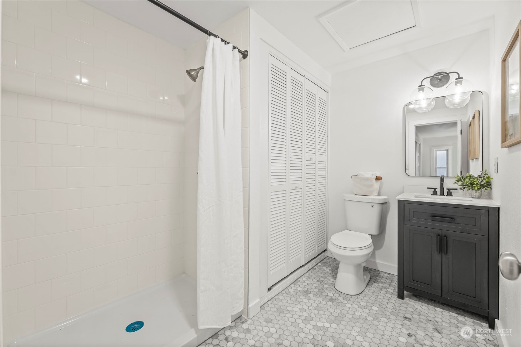 4008 66th Street Gig Harbor, WA 98335 - Photo 25 of 39 a bathroom with a sink toilet vanity and shower