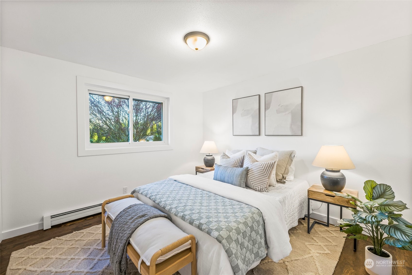 4008 66th Street Gig Harbor, WA 98335 - Photo 29 of 39 a bedroom with a bed and wooden floor