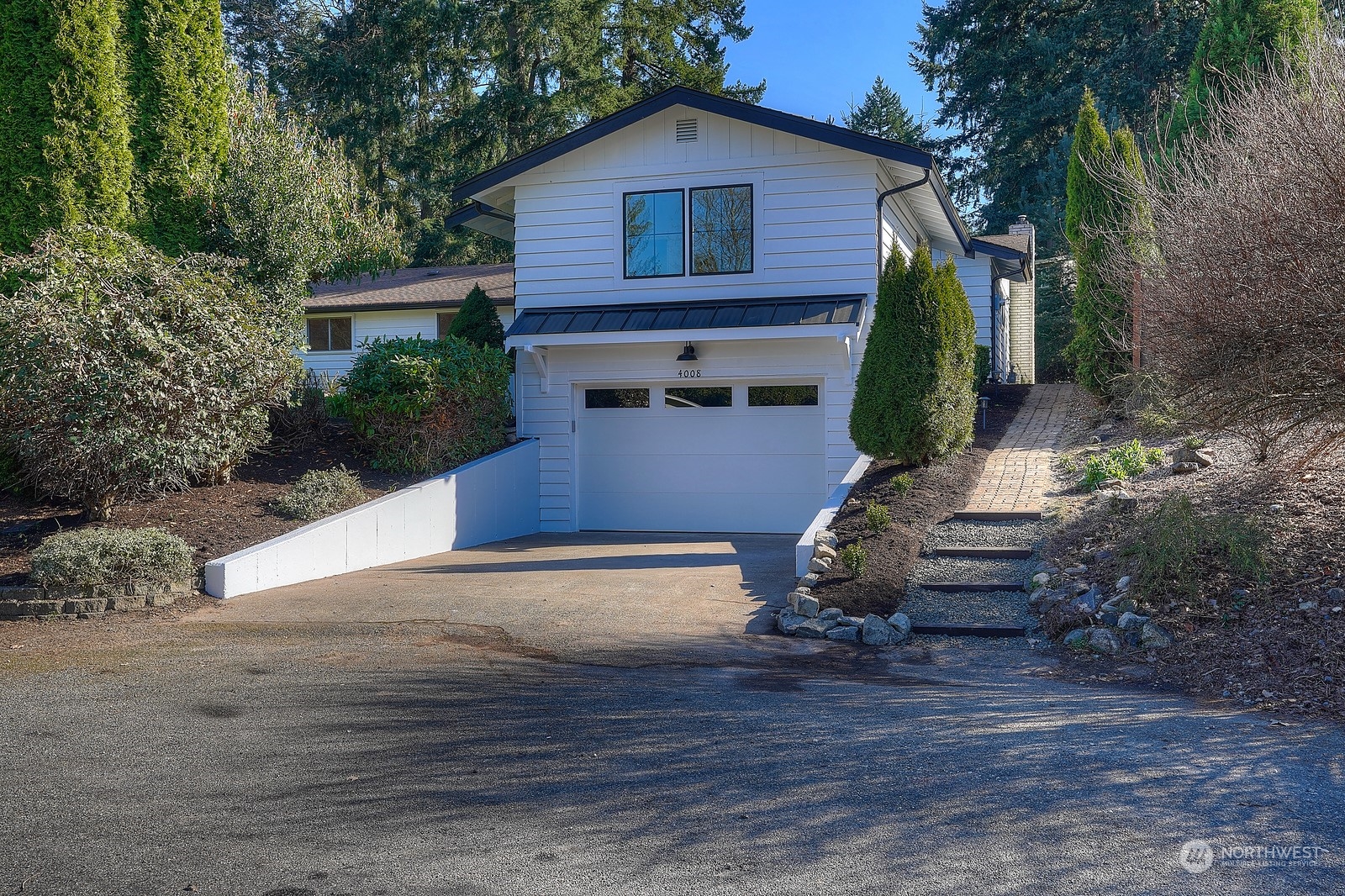 4008 66th Street Gig Harbor, WA 98335 - Photo 3 of 39 a front view of a house with garden