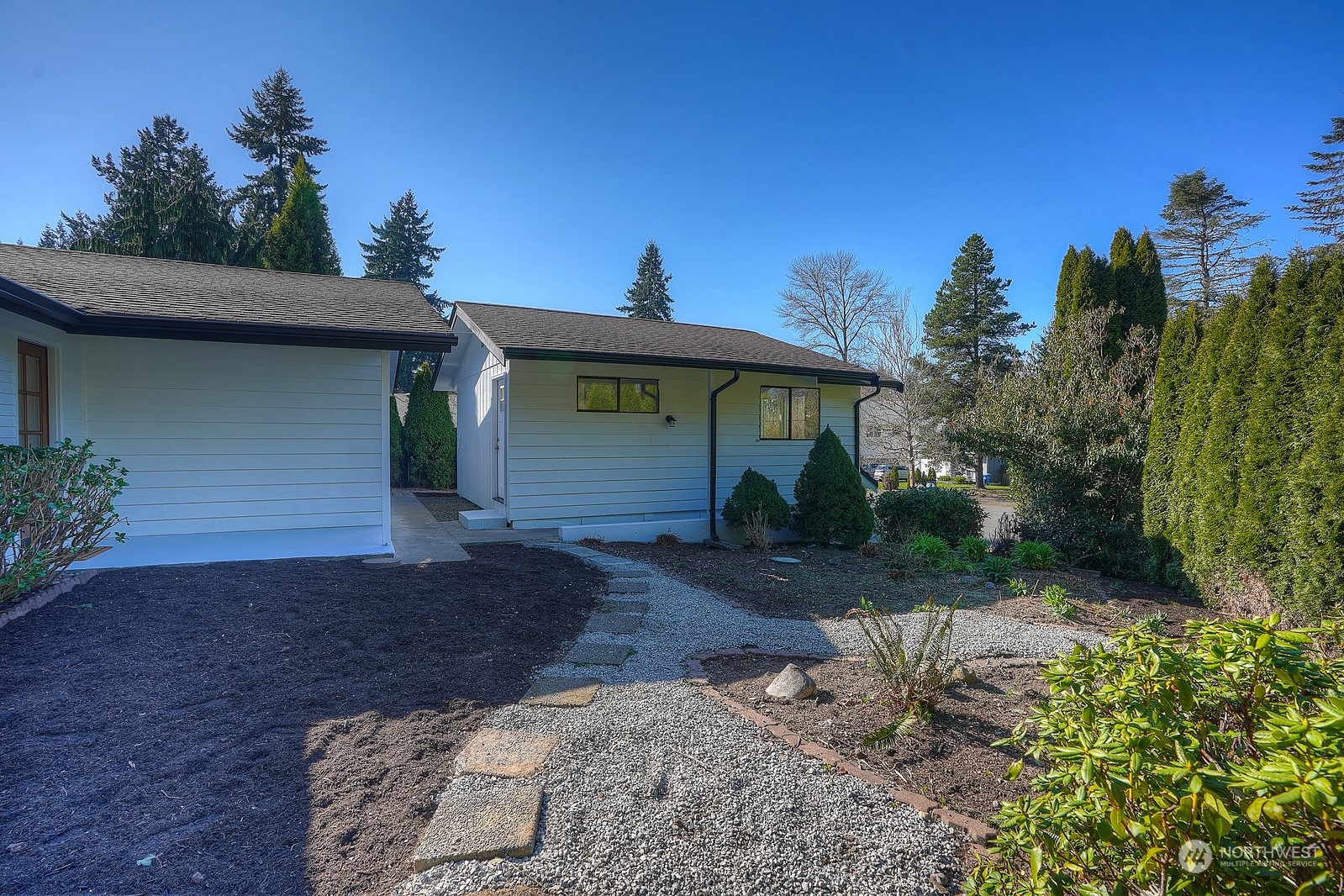 4008 66th Street Gig Harbor, WA 98335 - Photo 35 of 39 a front view of a house with a yard