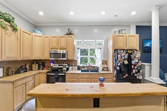a view of entryway with wooden floor and stair