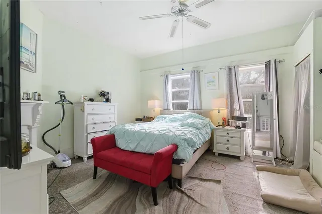 a living room with furniture and a mirror