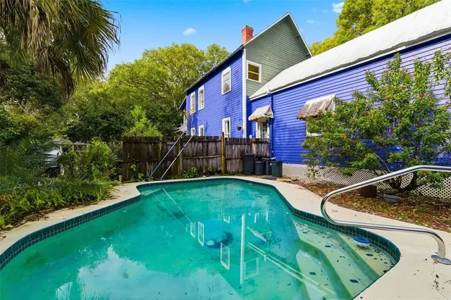 a view of a city with lush green forest