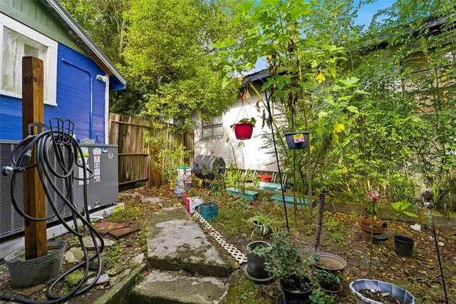 an aerial view of residential building with outdoor space and trees
