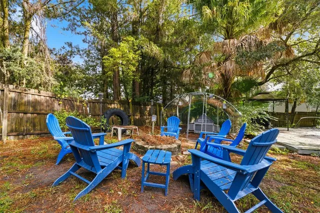 an aerial view of a house with a yard and lake view