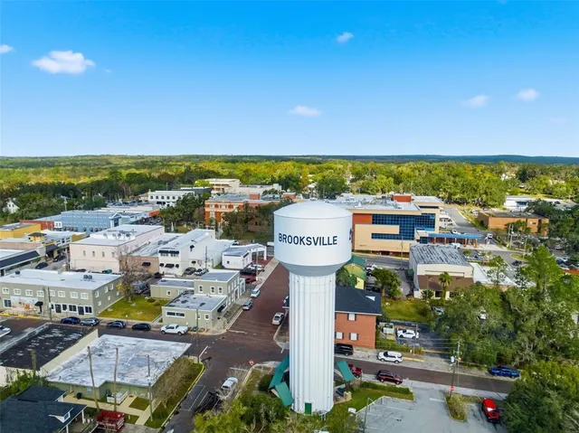 a kitchen with a stove a sink and a refrigerator