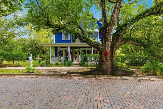 a bedroom with a bed and a fireplace
