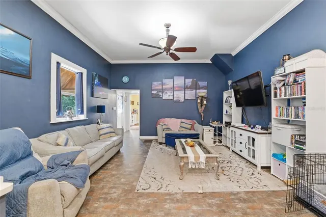 a kitchen with stainless steel appliances kitchen island granite countertop a refrigerator oven a sink dishwasher and white cabinets with wooden floor