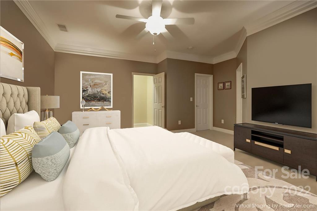 3229 Sapphire Lane Fort Mill, SC 29708 - Photo 15 of 40 a bedroom with a bed and a flat screen tv
