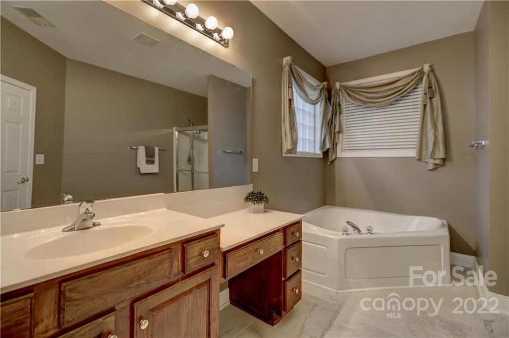3229 Sapphire Lane Fort Mill, SC 29708 - Photo 17 of 40 a bathroom with a sink a toilet and mirror