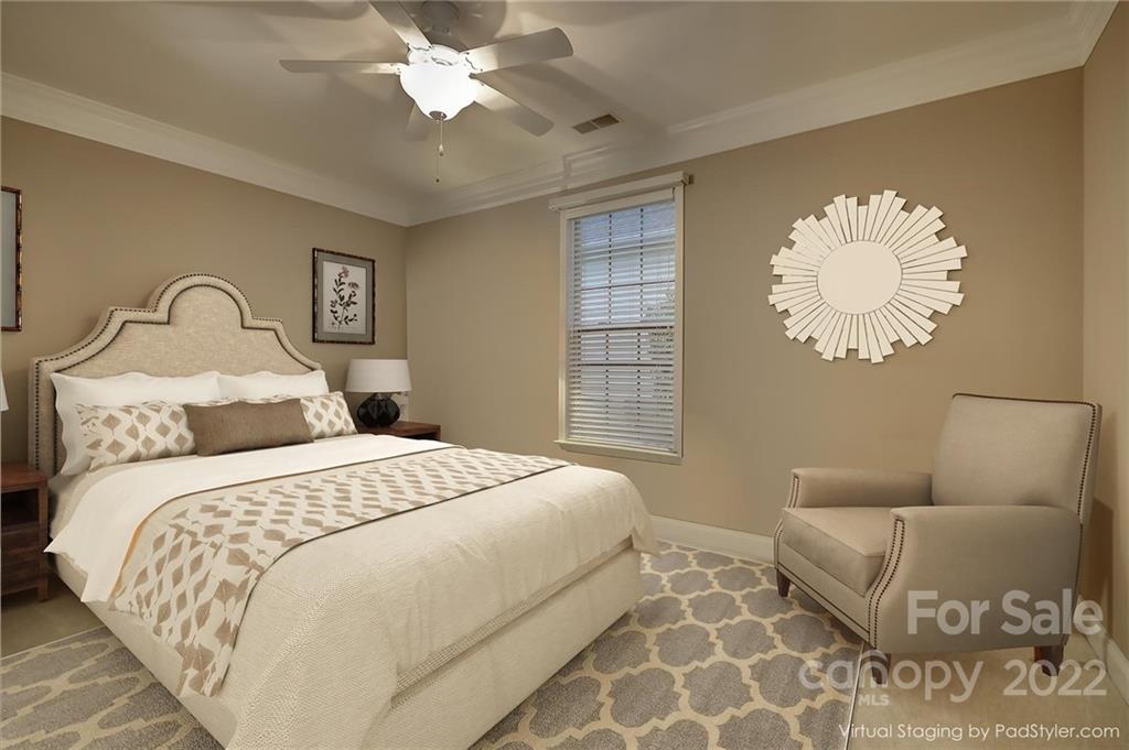 3229 Sapphire Lane Fort Mill, SC 29708 - Photo 18 of 40 a bedroom with a large bed and a chandelier