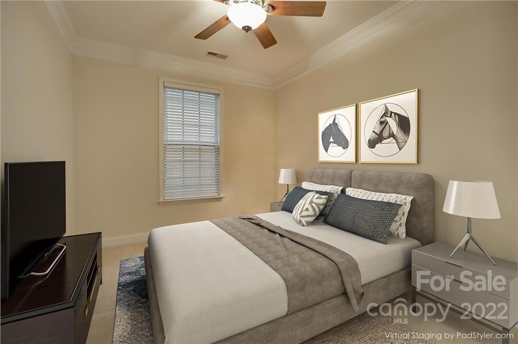 3229 Sapphire Lane Fort Mill, SC 29708 - Photo 19 of 40 a bedroom with a bed and a flat screen tv