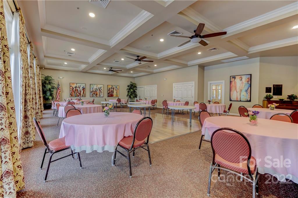 3229 Sapphire Lane Fort Mill, SC 29708 - Photo 30 of 40 a living room with lots of furniture and a chandelier