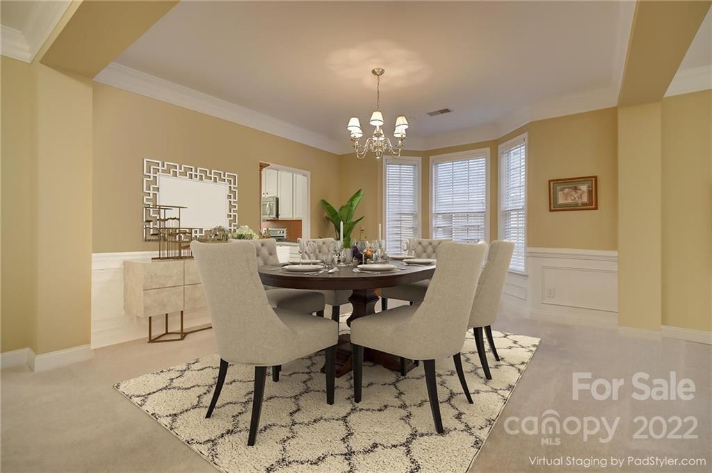 3229 Sapphire Lane Fort Mill, SC 29708 - Photo 3 of 40 a view of a dining room with furniture and chandelier