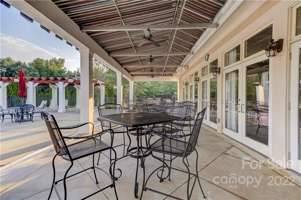 3229 Sapphire Lane Fort Mill, SC 29708 - Photo 32 of 40 a view of a patio with a table and chairs and potted plants