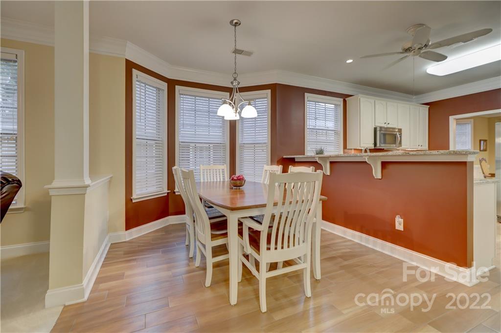 3229 Sapphire Lane Fort Mill, SC 29708 - Photo 9 of 40 a view of a dining room with furniture window and wooden floor