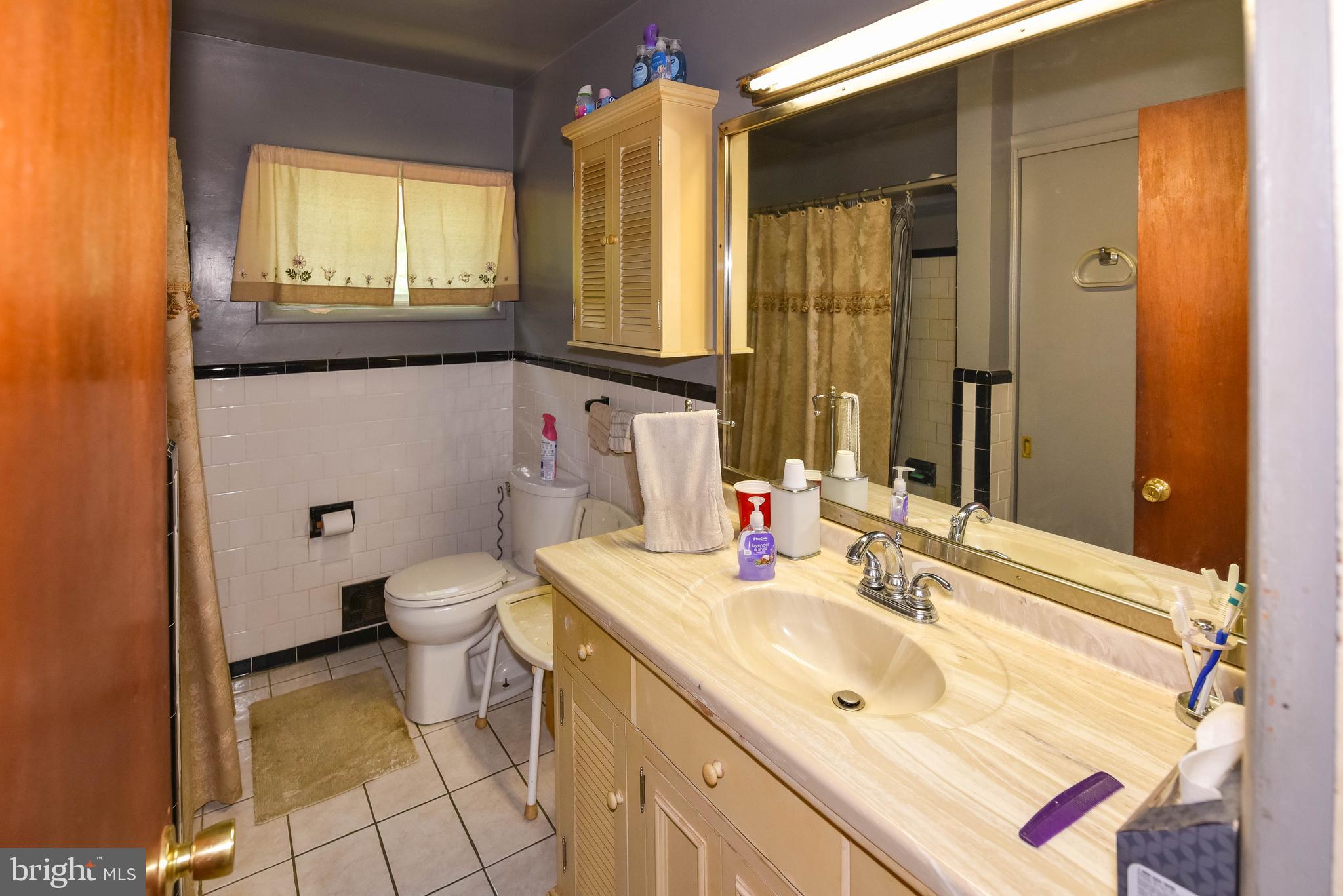 4428 Forge Road Perry Hall, MD 21128 - Photo 10 of 27 a bathroom with a sink and a mirror