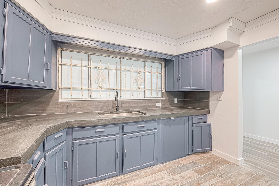 6718 Madrid Street Houston, TX 77021 - Photo 13 of 26 a kitchen with a sink cabinets and window