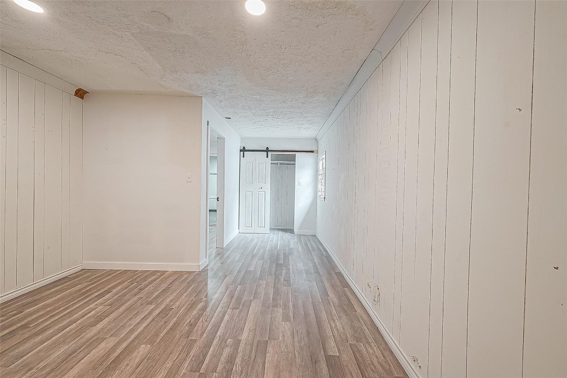 6718 Madrid Street Houston, TX 77021 - Photo 17 of 26 a view of a room with wooden floor
