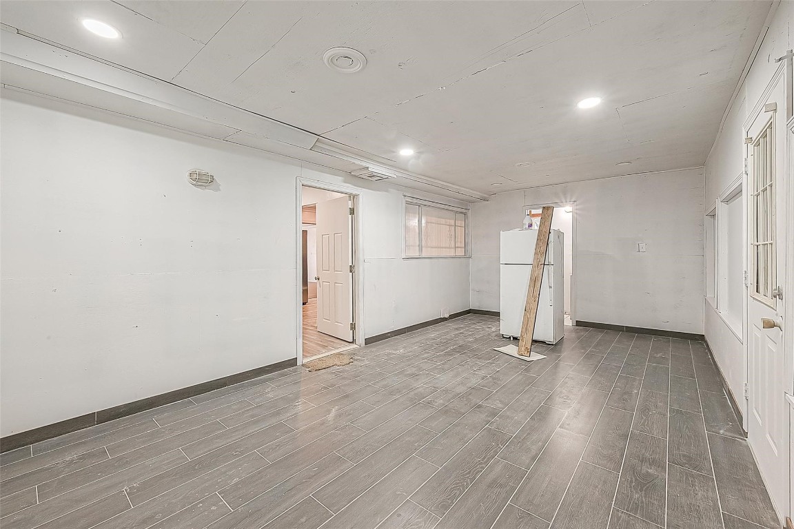 6718 Madrid Street Houston, TX 77021 - Photo 22 of 26 a view of an empty room with wooden floor