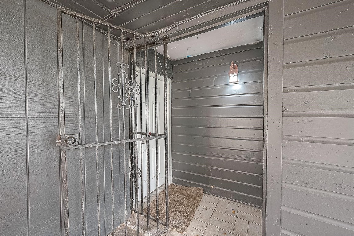 6718 Madrid Street Houston, TX 77021 - Photo 5 of 26 a bathroom with a shower and a glass door