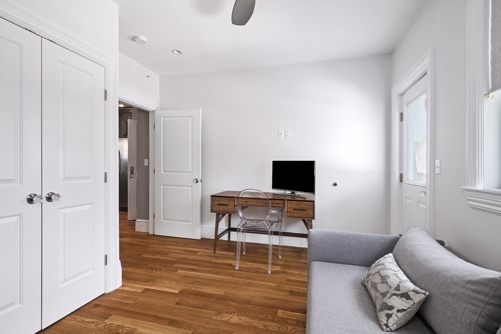 870 East 4th Street, Unit 2 Boston, MA 02127 - Photo 13 of 20 a living room with furniture and a flat screen tv