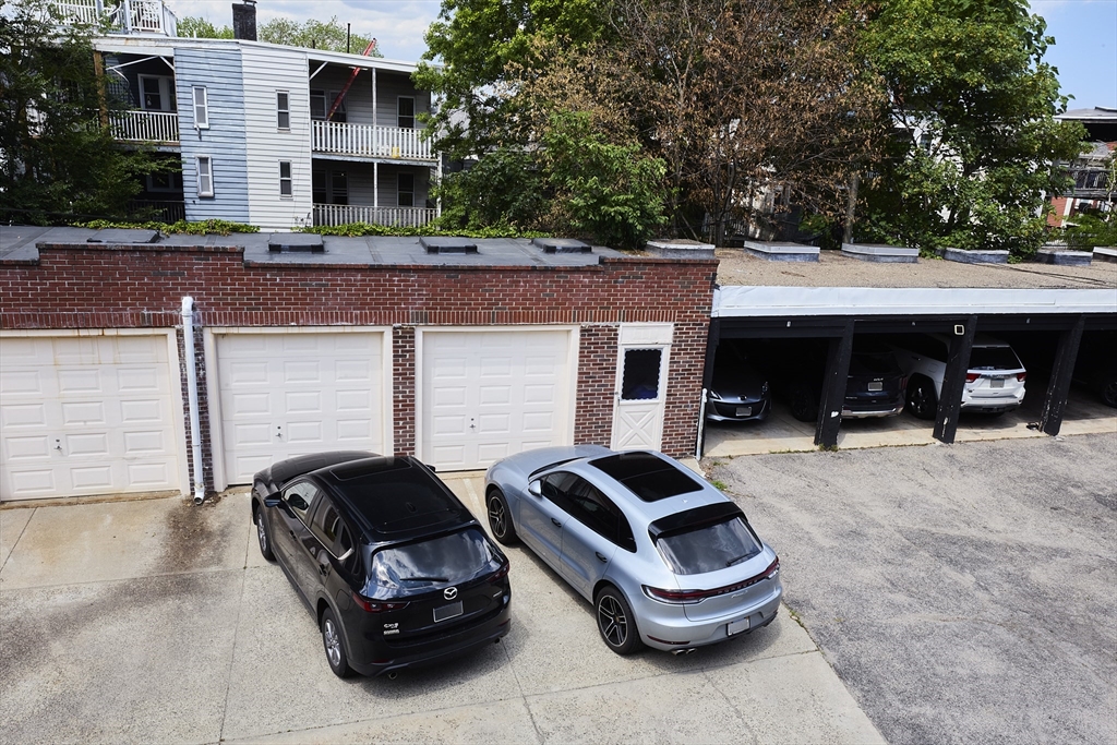 870 East 4th Street, Unit 2 Boston, MA 02127 - Photo 16 of 20 a front view of a house with car parked