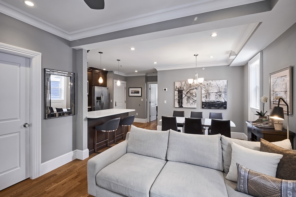 870 East 4th Street, Unit 2 Boston, MA 02127 - Photo 2 of 20 a living room with furniture and a large window