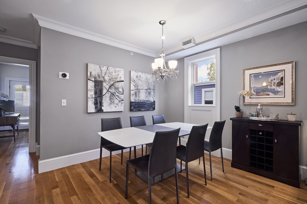 870 East 4th Street, Unit 2 Boston, MA 02127 - Photo 3 of 20 a view of a dining room with furniture window and wooden floor