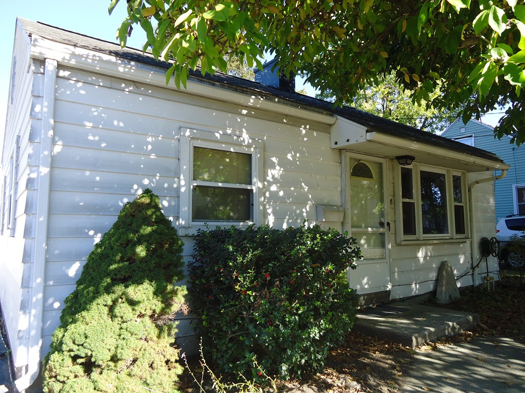 68 Victoria Street Springfield, MA 01104 - Photo 1 of 14 a front view of a house with a yard