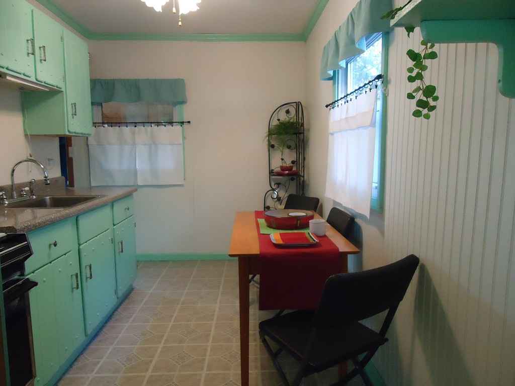68 Victoria Street Springfield, MA 01104 - Photo 2 of 14 a room with cabinets and furniture