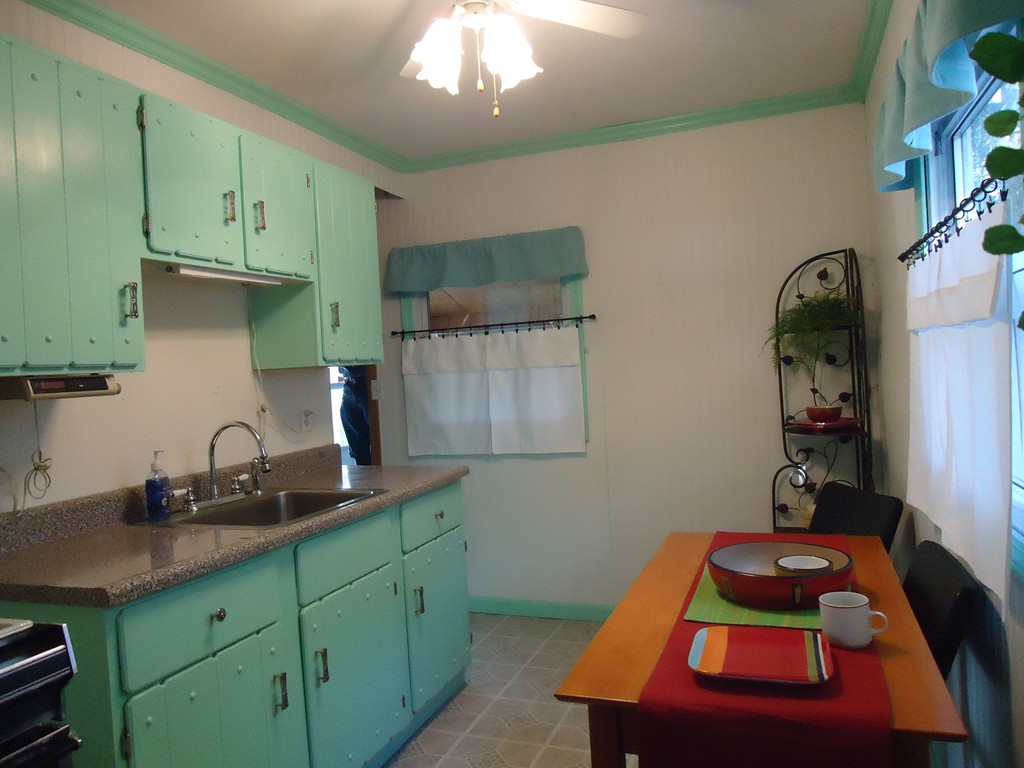 68 Victoria Street Springfield, MA 01104 - Photo 3 of 14 a room with wooden floor and cabinets