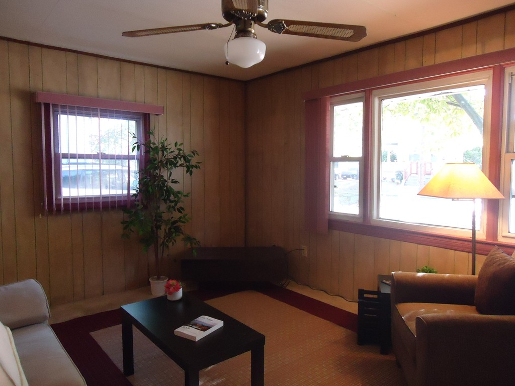 68 Victoria Street Springfield, MA 01104 - Photo 7 of 14 a living room with furniture and a window