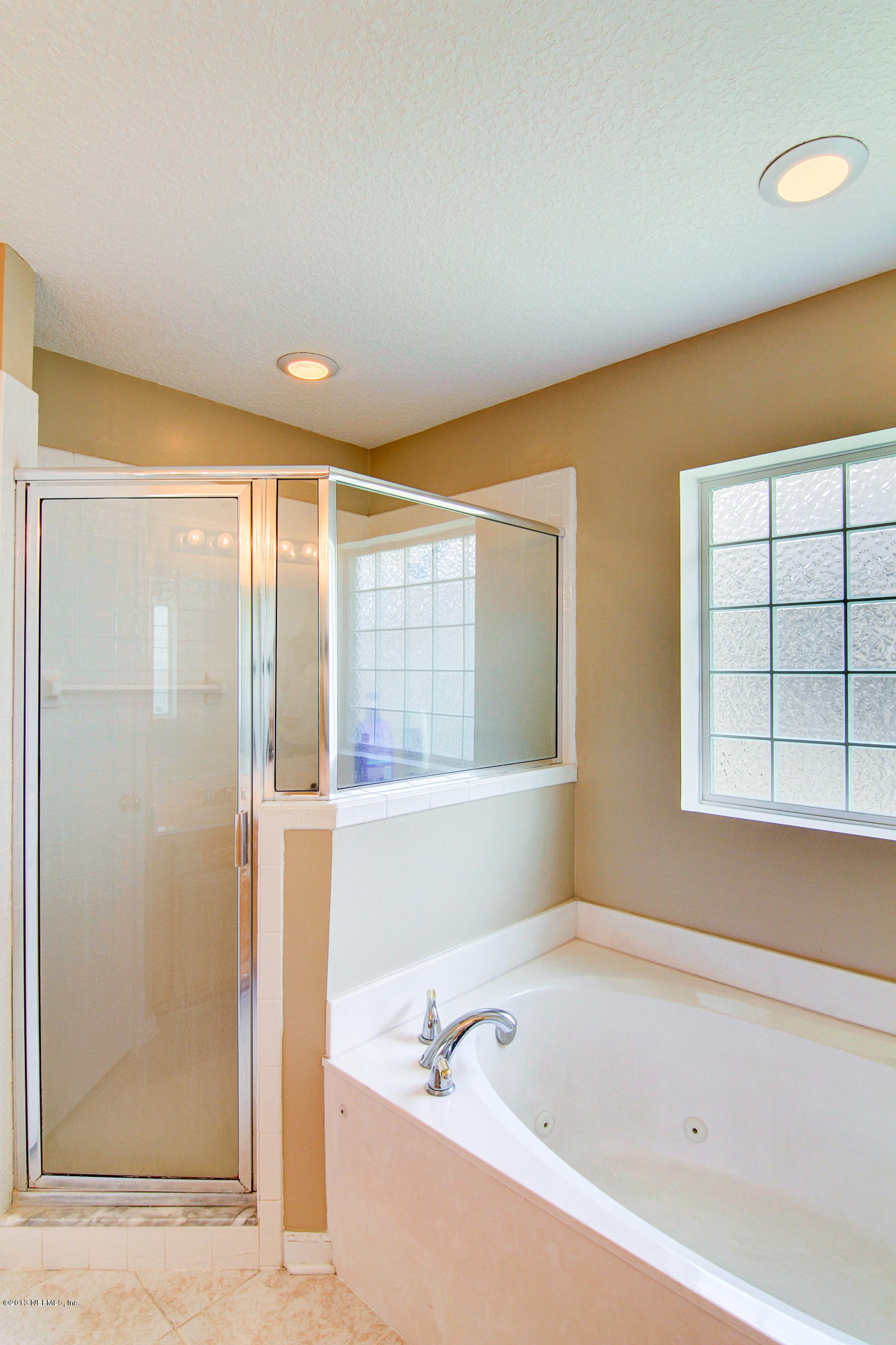 6527 Ginnie Springs Road Jacksonville, FL 32258 - Photo 25 of 35 Garden Tub and standing shower