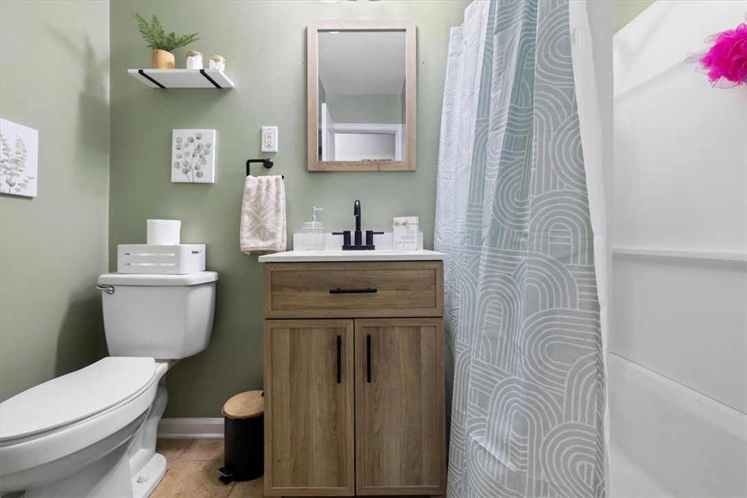 1482 Lee Road Troy, OH 45373 - Photo 9 of 30 This refreshing bathroom features modern fixtures and ample storage, creating a functional and stylish space.