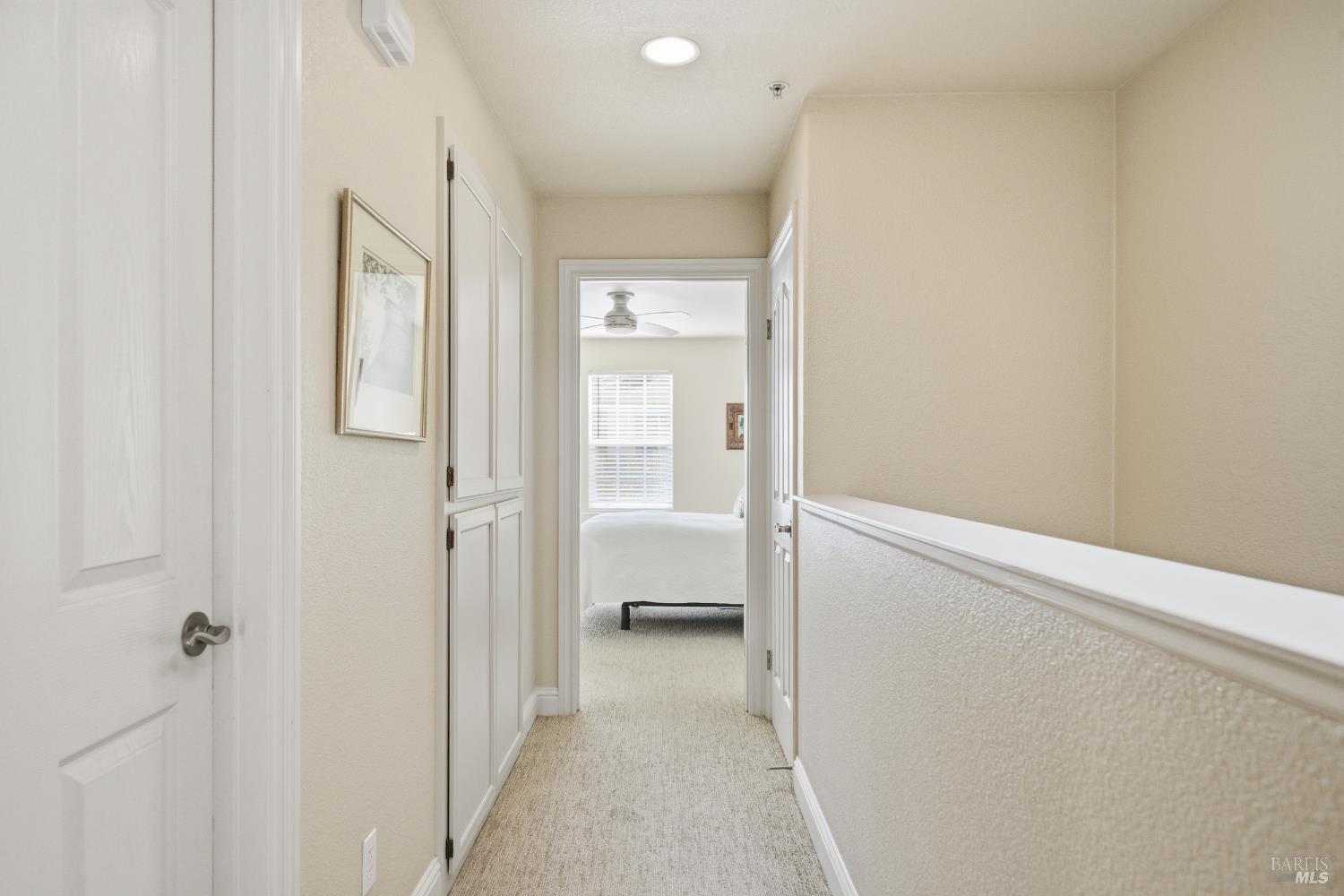 191 Johnson Street Windsor, CA 95492 - Photo 16 of 34 a view of a hallway with wooden floor and a bathroom