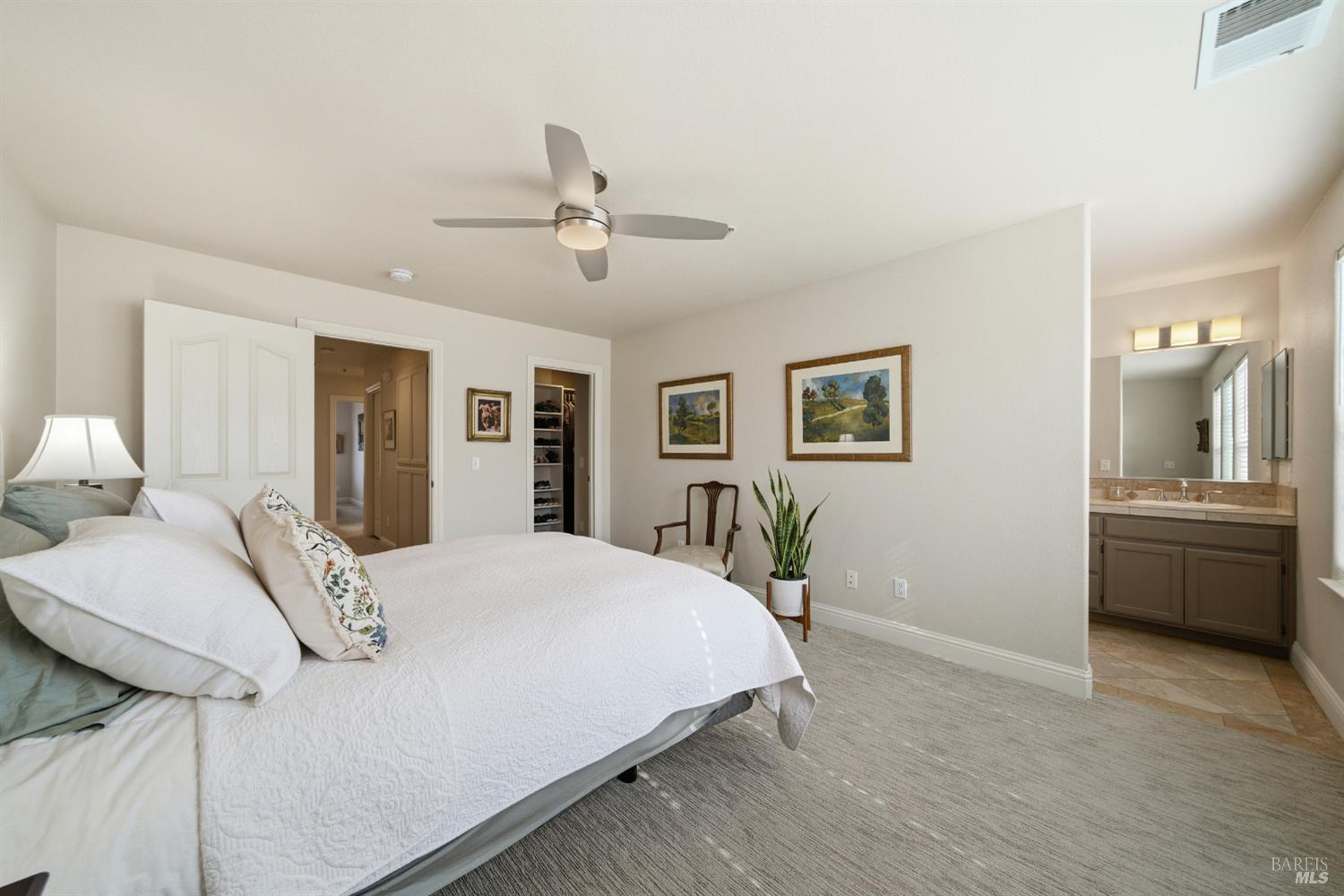 191 Johnson Street Windsor, CA 95492 - Photo 18 of 34 a bedroom with a large bed and a chandelier