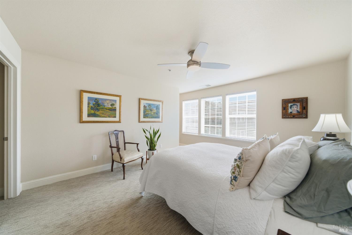 191 Johnson Street Windsor, CA 95492 - Photo 22 of 34 a large bedroom with a bed and table chair