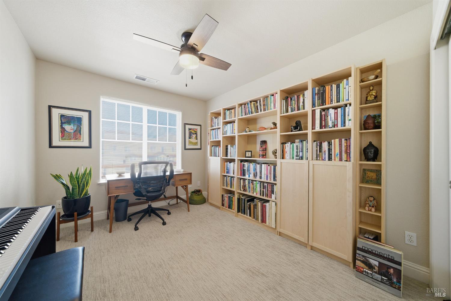 191 Johnson Street Windsor, CA 95492 - Photo 25 of 34 a view of a workspace with furniture and a book shelf