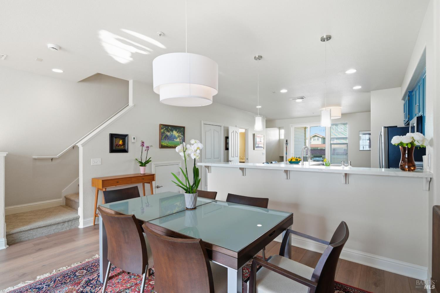 191 Johnson Street Windsor, CA 95492 - Photo 3 of 34 a living room with furniture and a dining table with kitchen view