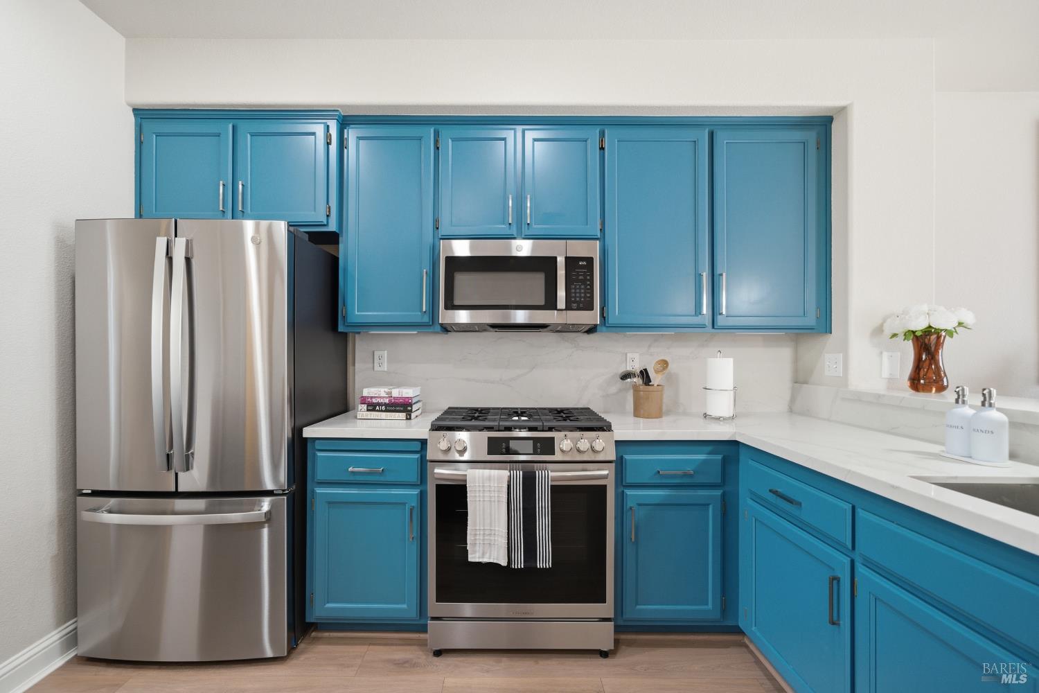 191 Johnson Street Windsor, CA 95492 - Photo 10 of 34 a kitchen with cabinets stainless steel appliances and a sink
