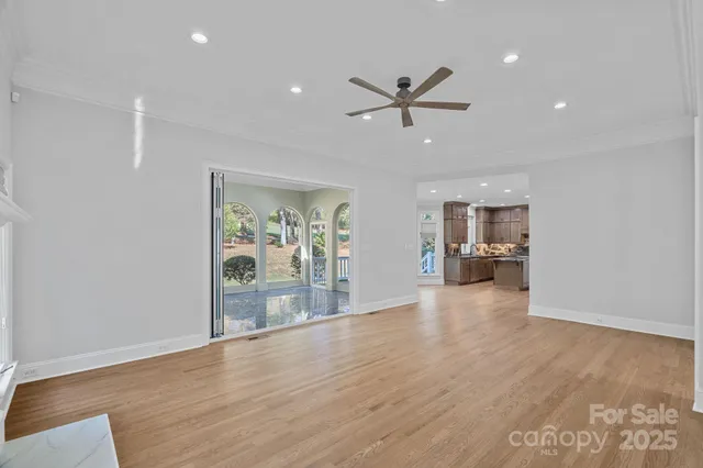 a spacious bathroom with a granite countertop sink a mirror and a shower