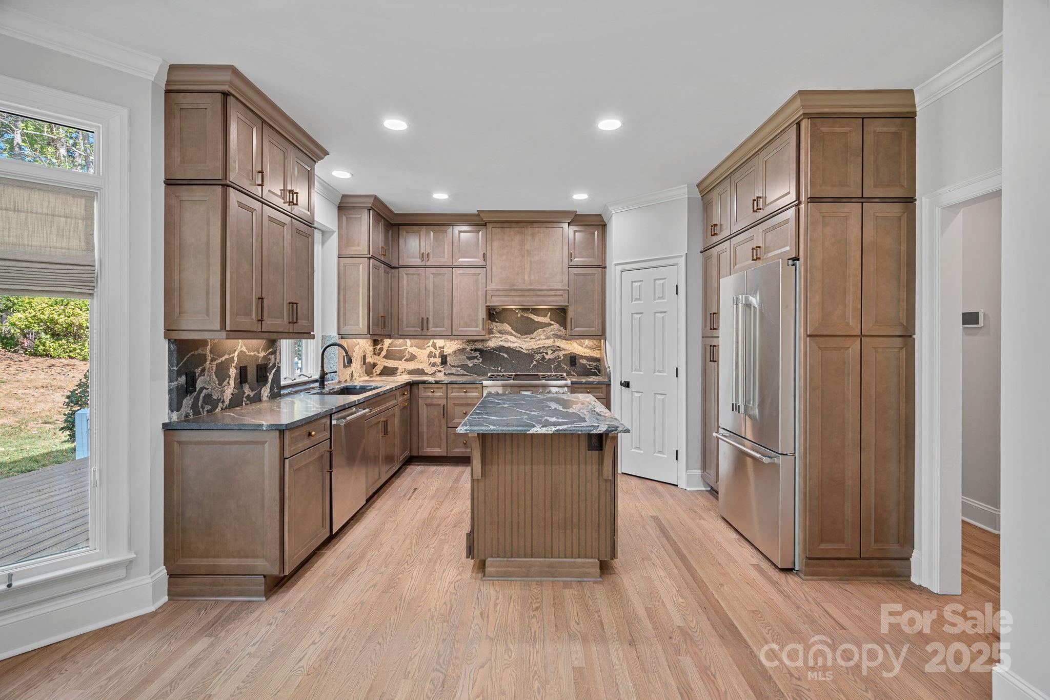 17608 River Ford Drive Davidson, NC 28036 - Photo 15 of 48 a kitchen with stainless steel appliances granite countertop a refrigerator a sink and a stove