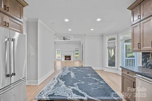 a white bath tub sitting in a bathroom next to a window