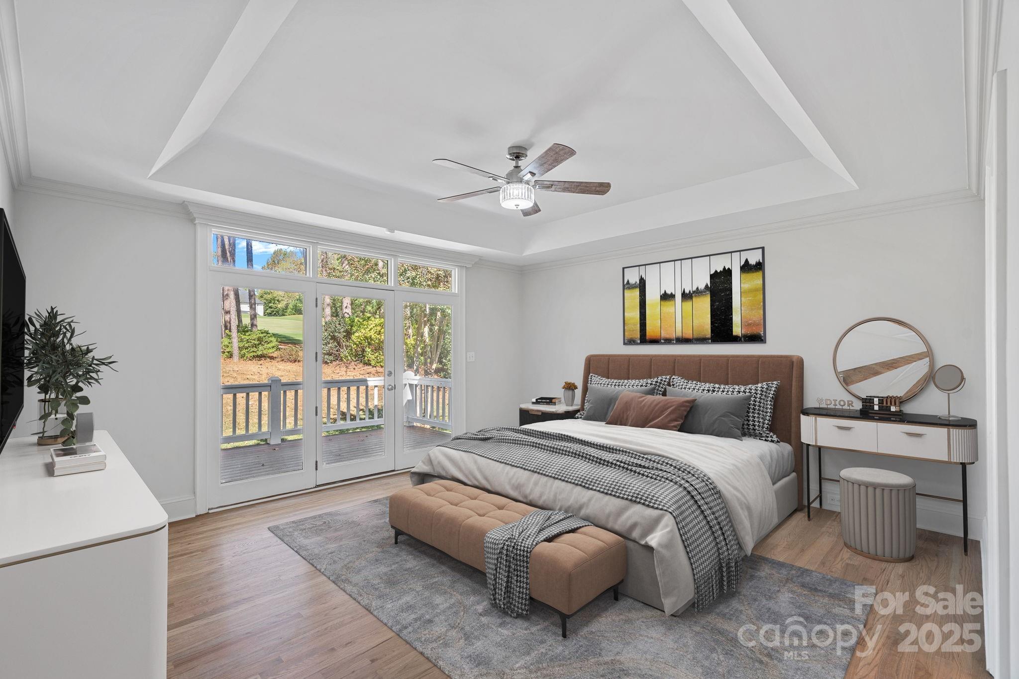 17608 River Ford Drive Davidson, NC 28036 - Photo 22 of 48 a bedroom with a balcony a bed and a large window with potted plants