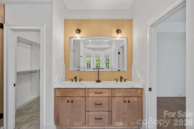 a white bath tub sitting in a bathroom next to a window