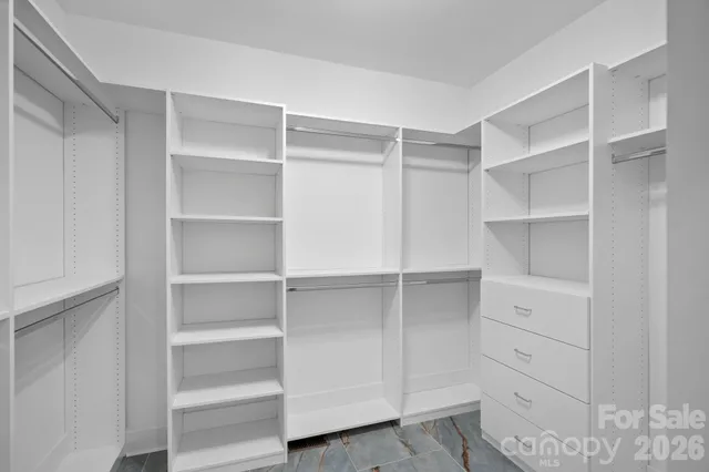 a close view of a sink a mirror and vanity