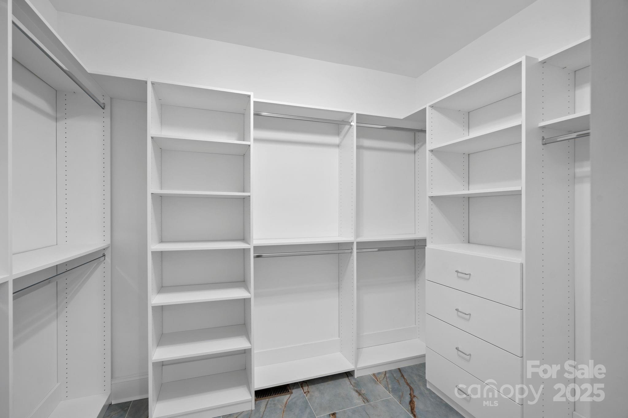 17608 River Ford Drive Davidson, NC 28036 - Photo 27 of 48 a view of walk in closet with empty racks